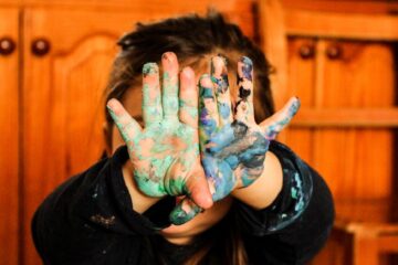 girl covering her face with her hands