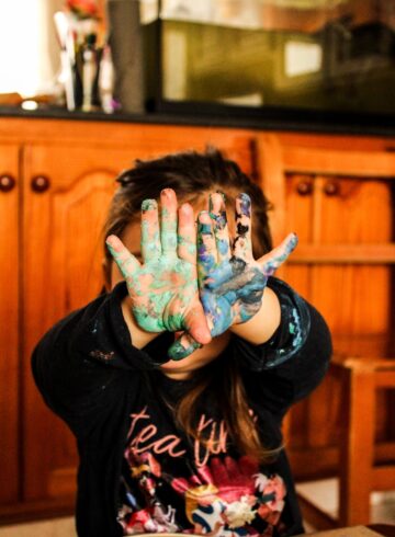 girl covering her face with her hands