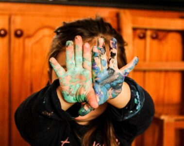 girl covering her face with her hands