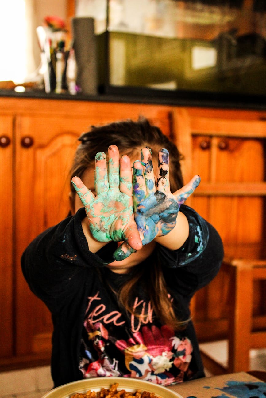 girl covering her face with her hands
