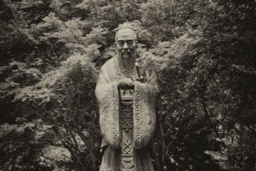 grayscale photo of statue of confucius