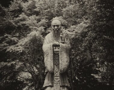 grayscale photo of statue of confucius