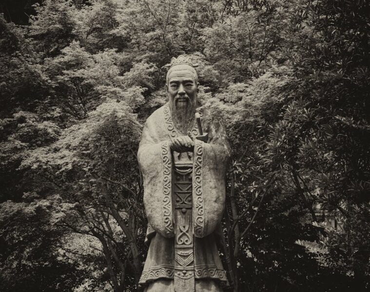 grayscale photo of statue of confucius