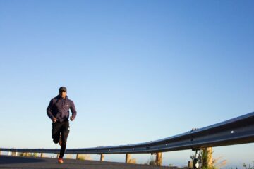 photo of man running during daytime