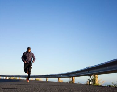 photo of man running during daytime