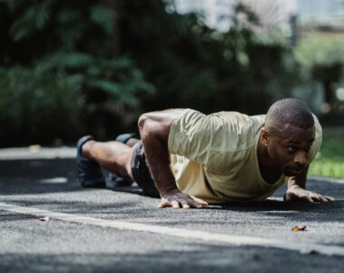 an athletic man doing push ups