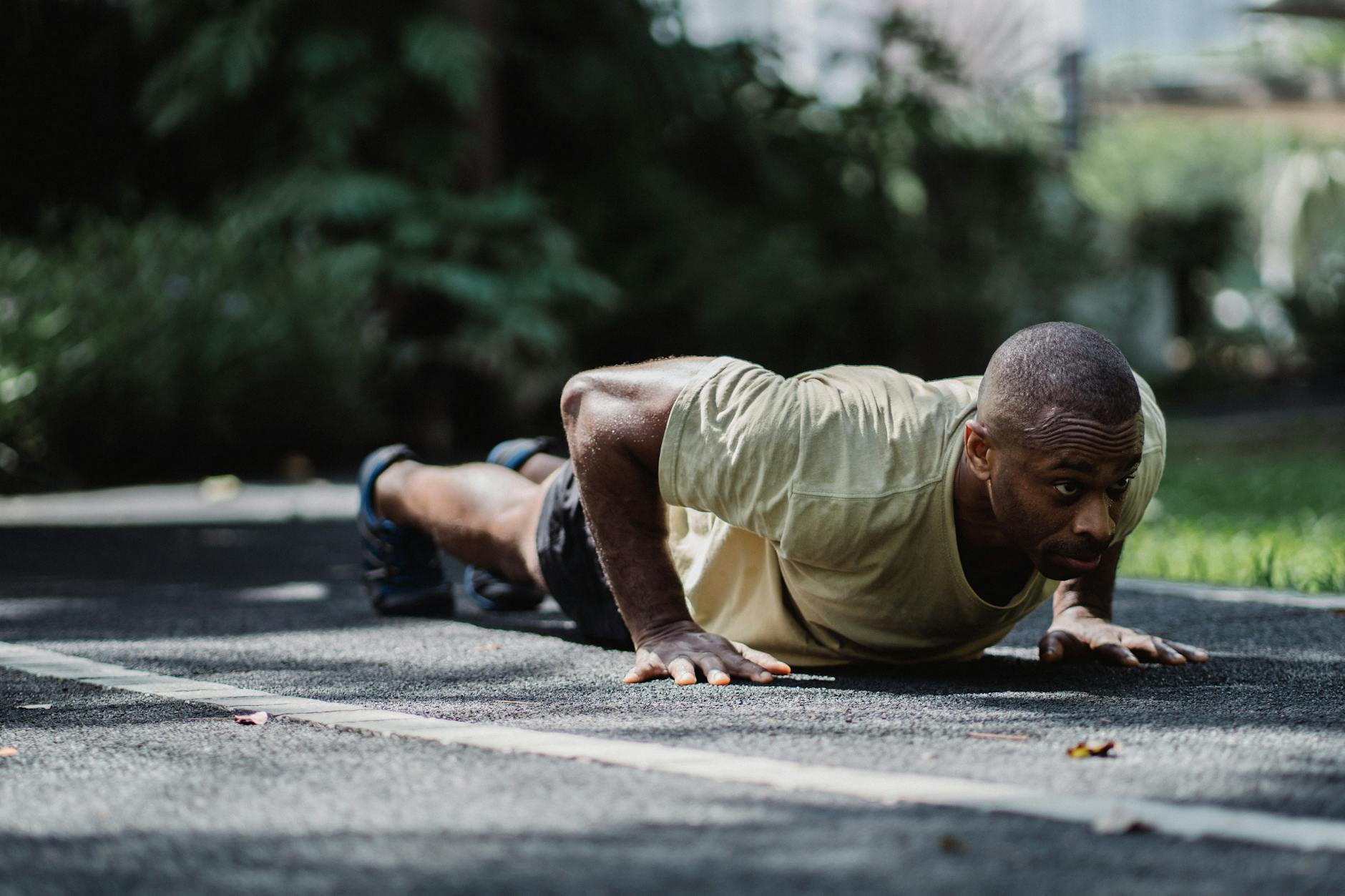 an athletic man doing push ups