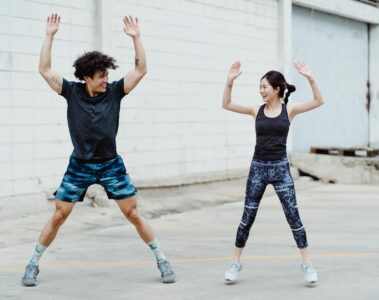 a couple doing jumping jack