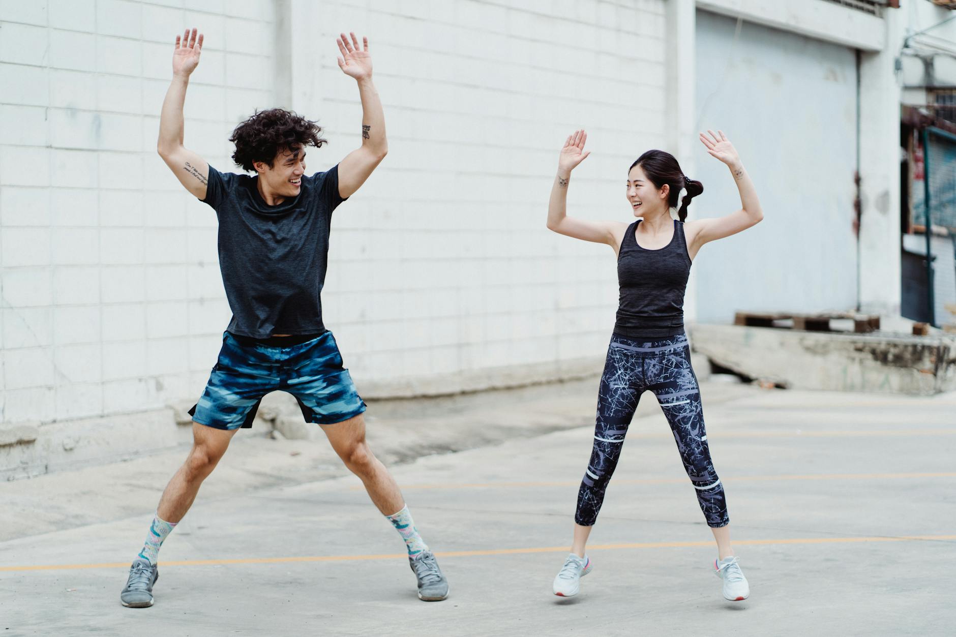 a couple doing jumping jack